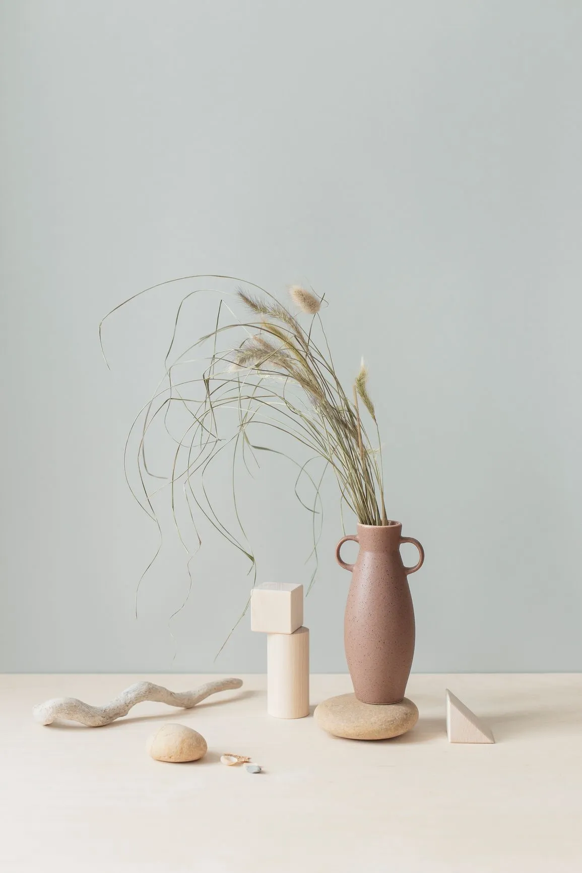 fern in vase leaning left