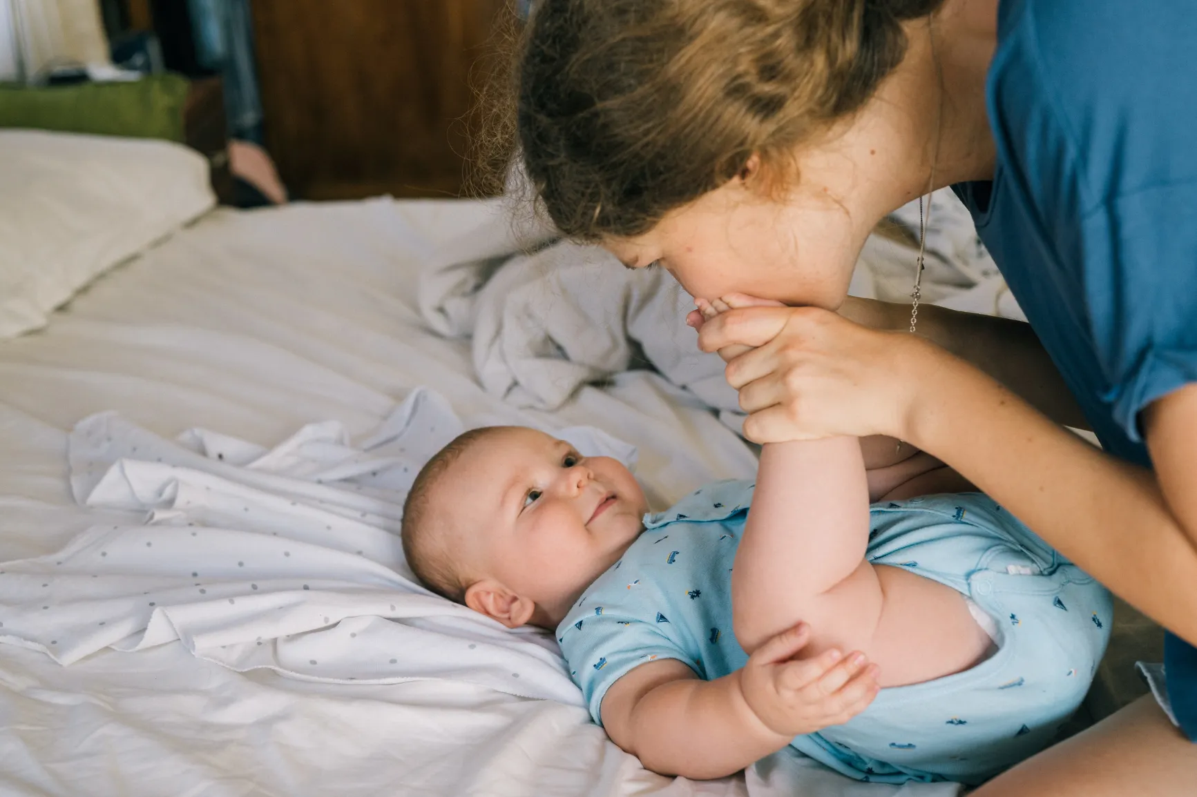 Mother kissing baby