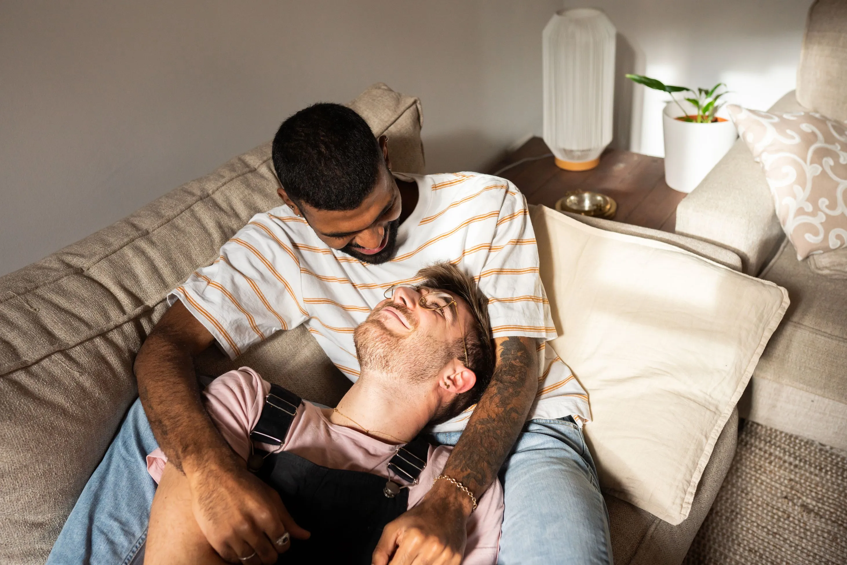 Gay male couple relaxing affectionately